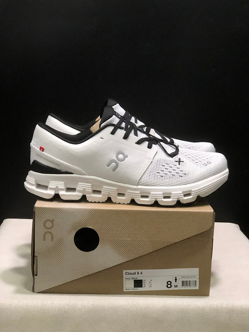 On Cloud X 4 Sneakers in Ivory and Black - product image from the listing.