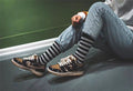 Black and Tan Jordan 1 High Paisley Pattern Sneakers - product image from the listing.