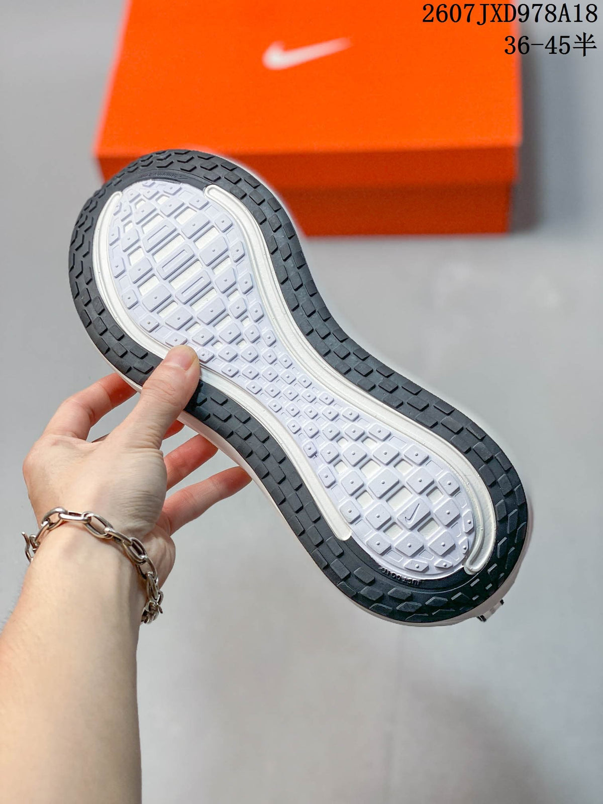 Nike Vomero Plus Running Sneakers in Dark Gray White 2607JXD978A18 - product image from the listing.