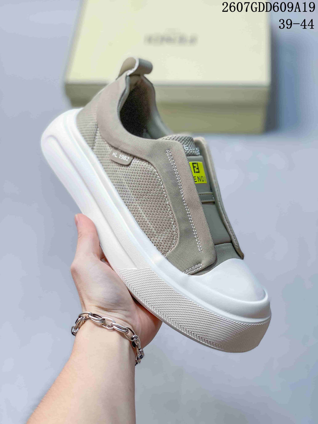 Fendi GDD609A19 Slip-On Sneakers in Taupe and White - product image from the listing.