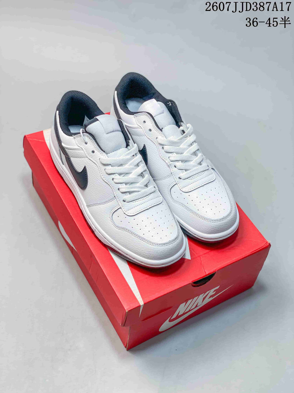 Nike Big Nike Low Sneakers in Black, Green, in White and Navy - product image from the listing.