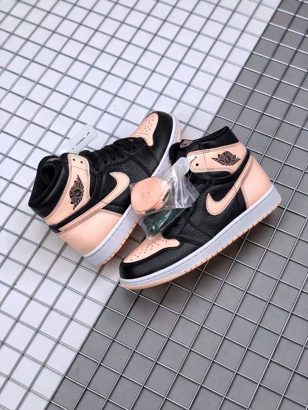 Air Jordan 1 High OG Crimson Tint Sneakers in Black Pink - product image from the listing.