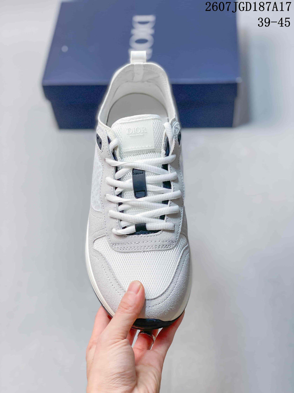 Dior B25 Runner Low-Top Sneakers in White and Gray 2607JGD187A17 - product image from the listing.