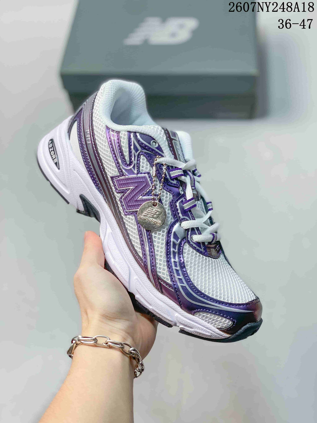 New Balance 740 Sneakers in White and Purple - product image from the listing.