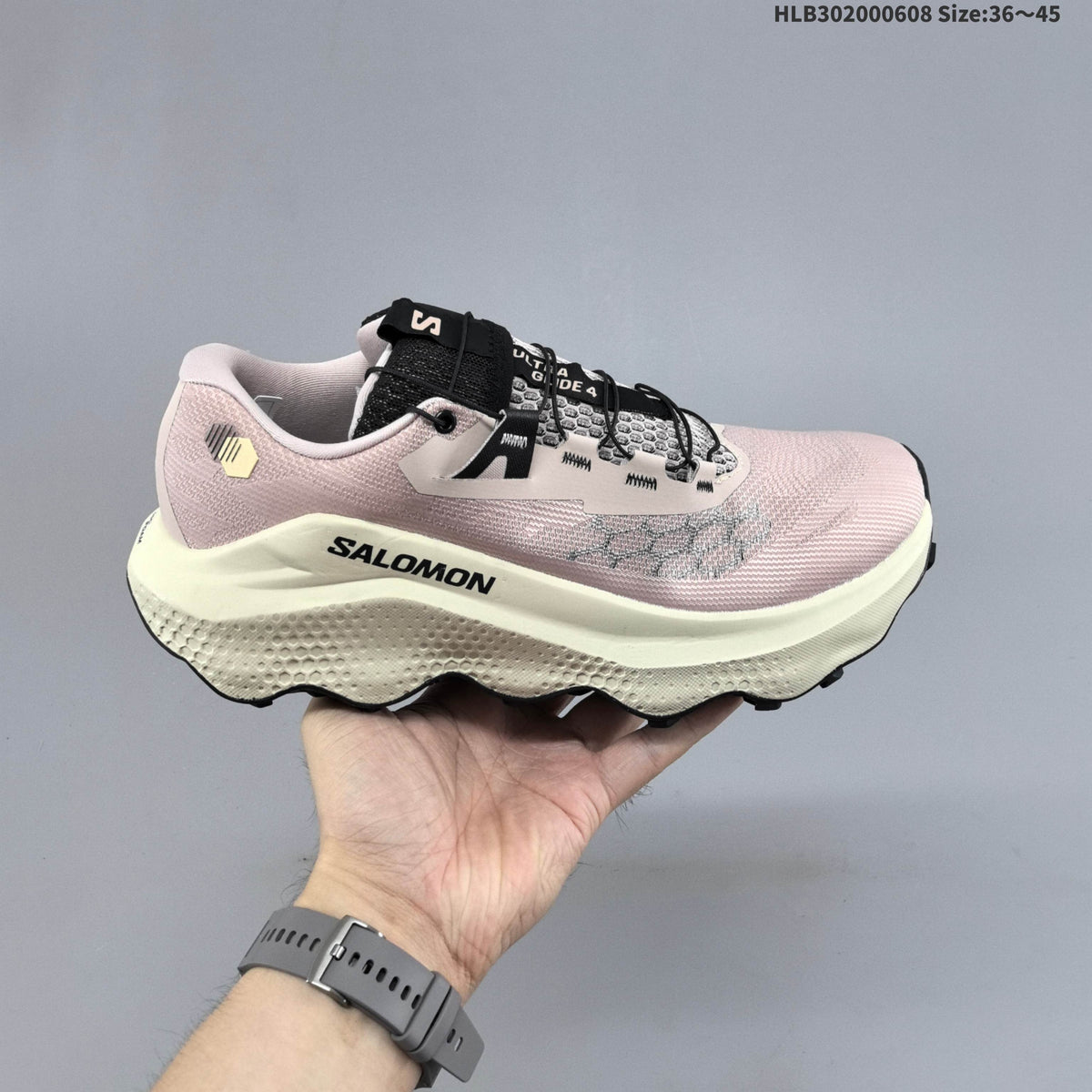 Salomon Ultra Glide 4 Trail Running Shoes, in Pink and Cream - product image from the listing.
