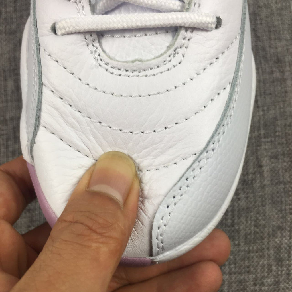 Air Jordan 12 Cherry Blossom Pink Sneakers - product image from the listing.