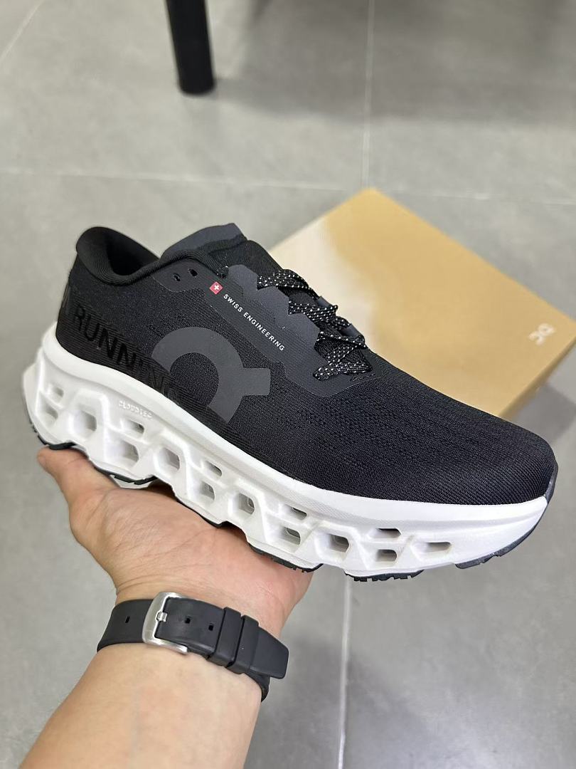 On Running Black and White Road Sneakers for Running - product image from the listing.