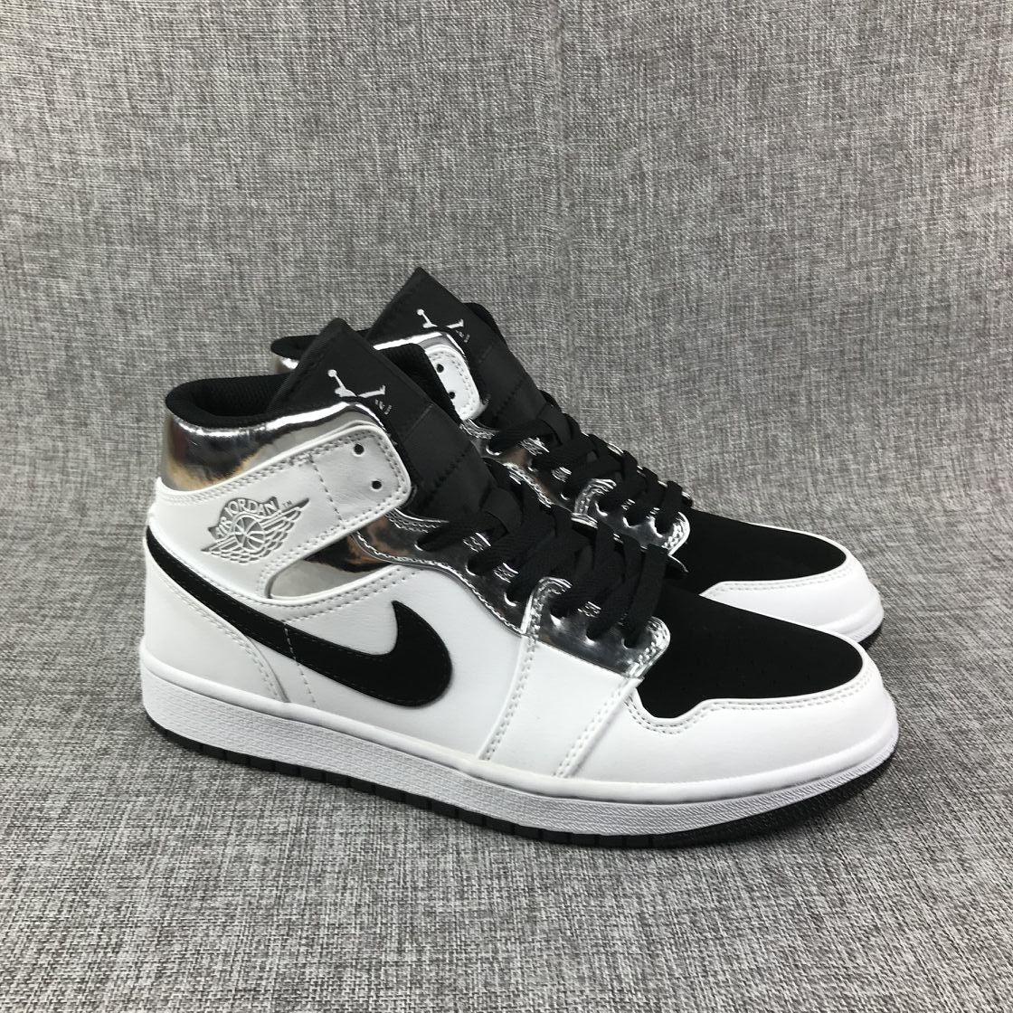 Air Jordan 1 Mid Sneakers in White and Black - product image from the listing.