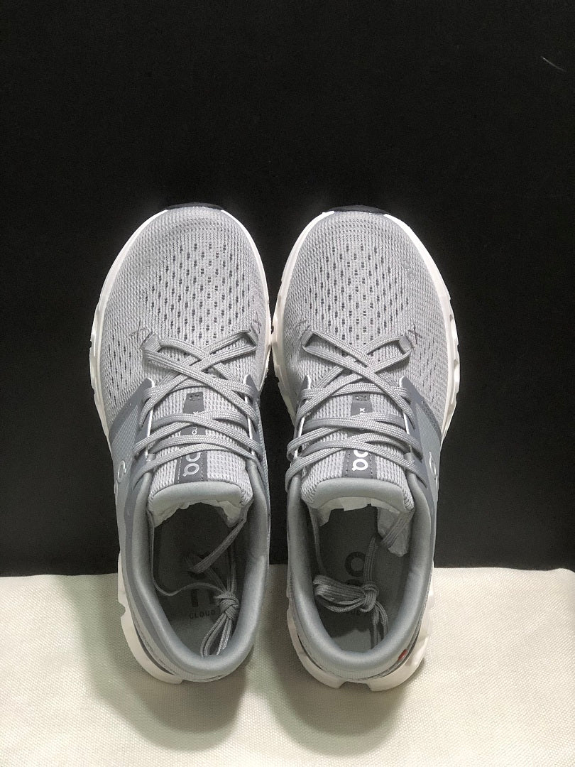 On Cloud X 4 Sneakers in Alloy and in Ivory - product image from the listing.