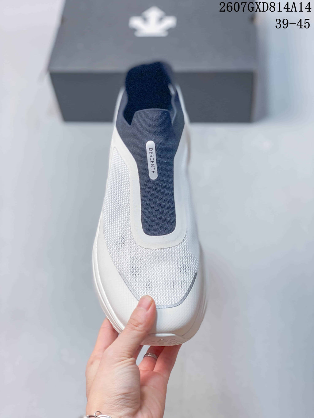 Descente Slip-On Sneakers in White and Navy 2607GXD814A14 - product image from the listing.