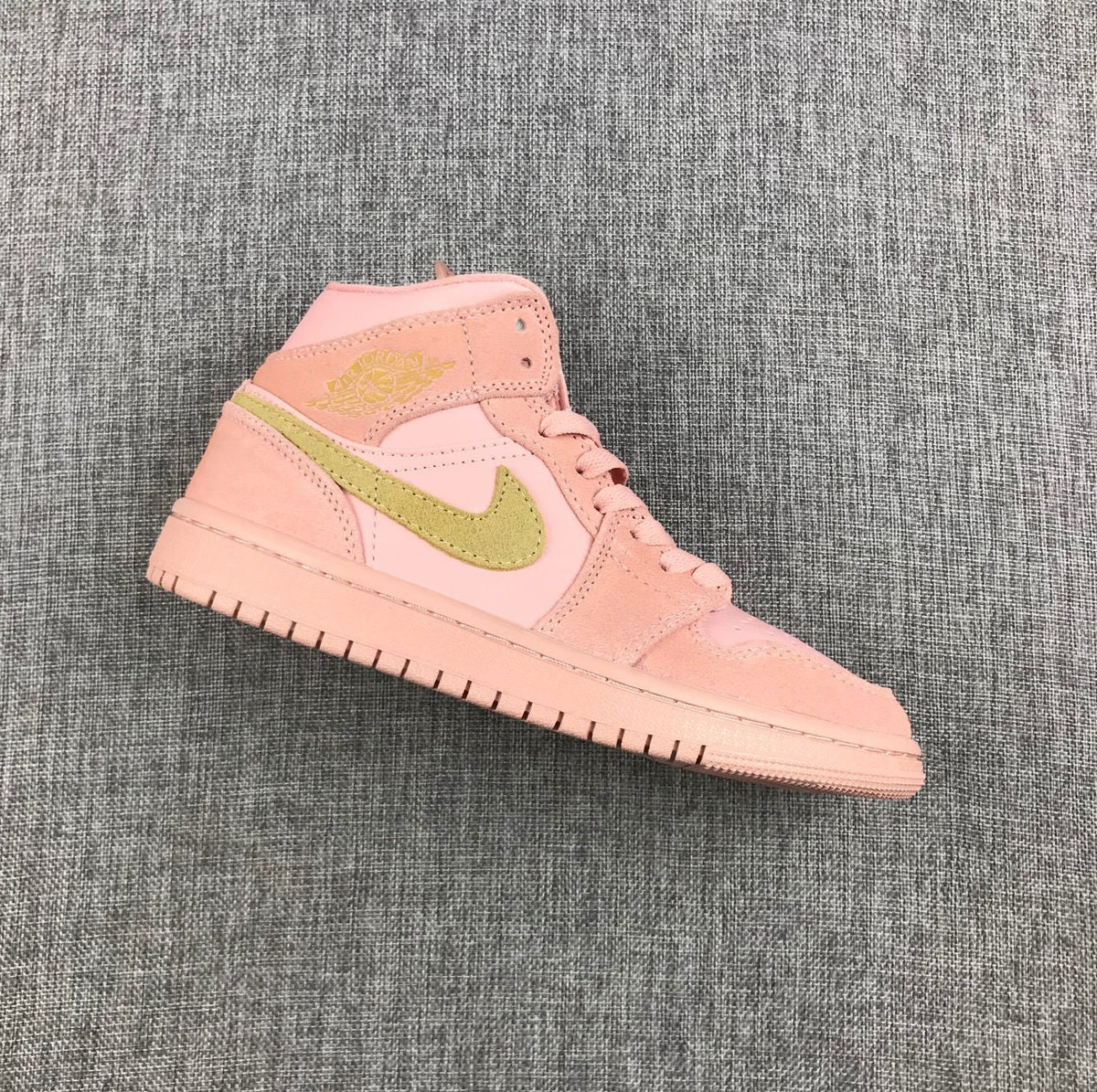 Jordan 1 Mid SE Sneakers in Pink 852542-600 - product image from the listing.