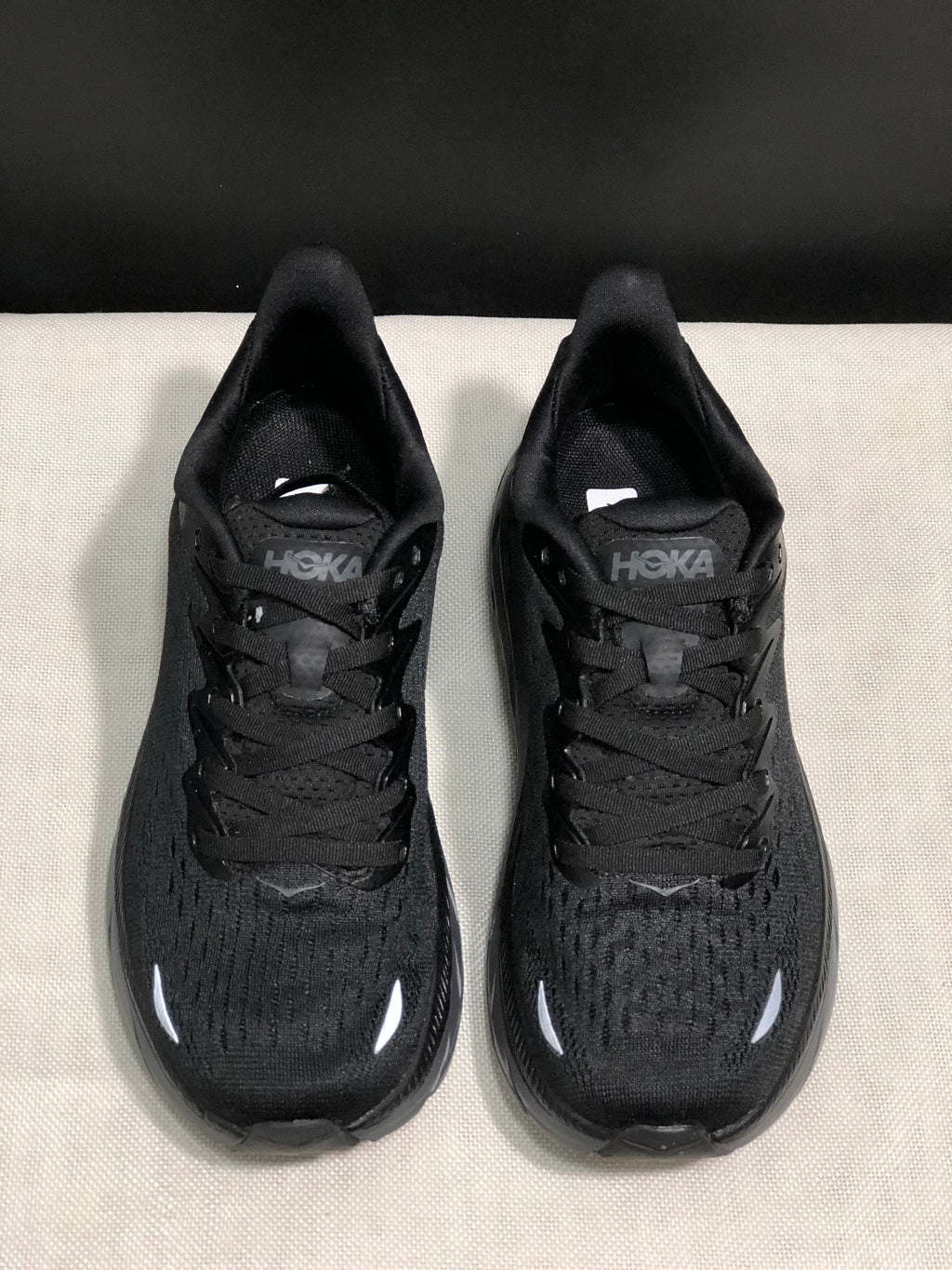HOKA Clifton 8 Shoes for Running, Black and Ink Wash - product image from the listing.