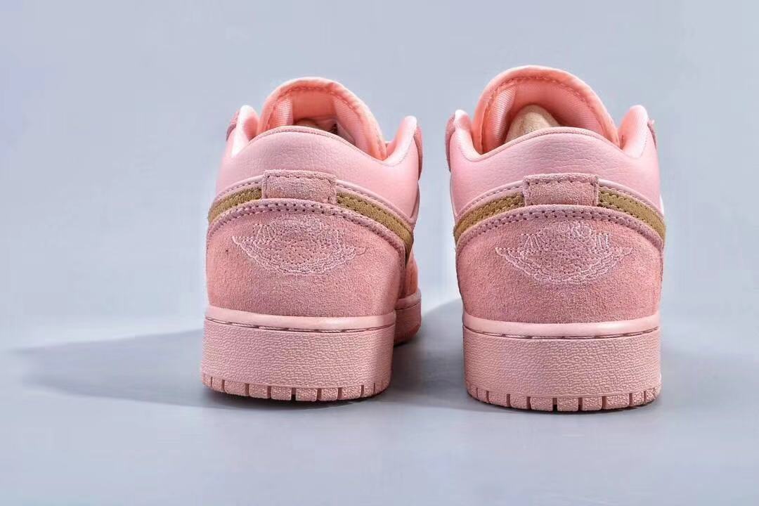 Women's Jordan 1 Low Pink and Gold Sneakers - product image from the listing.