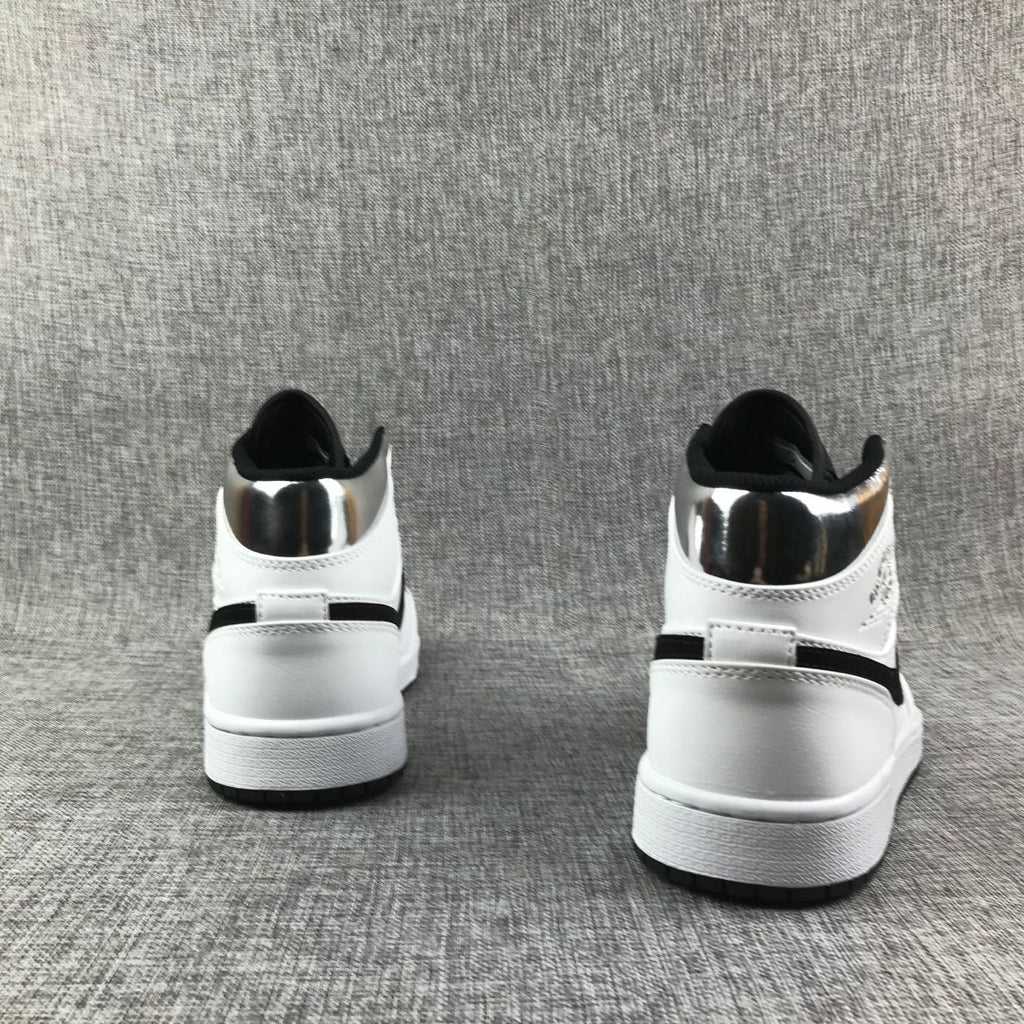 Air Jordan 1 Mid Sneakers in White and Black - product image from the listing.