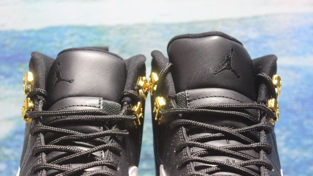 Air Jordan 12 Wings Black White Gold Sneakers 848692-033 - product image from the listing.