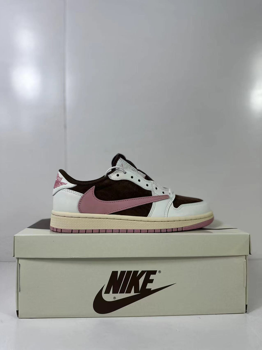 Jordan 1 Low Travis Scott in Brown White Pink DZ4137-206 - product image from the listing.