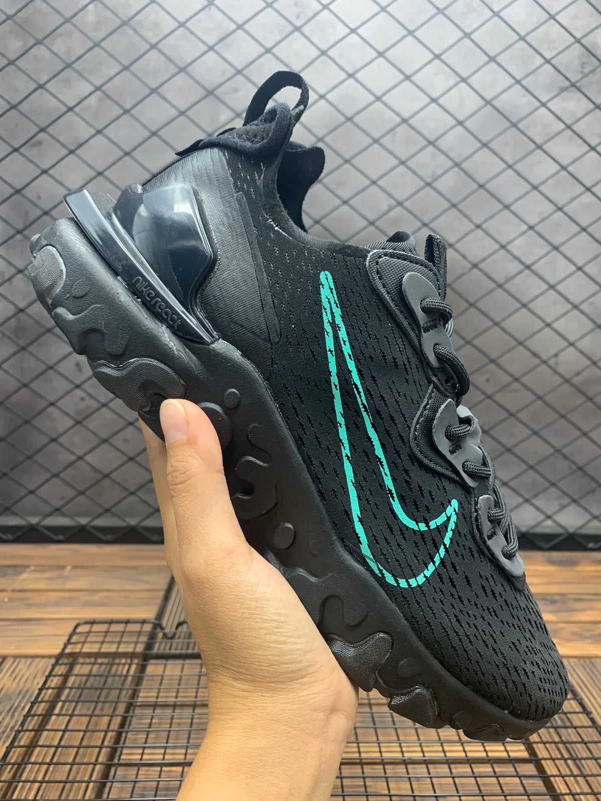 Nike React Black Trainers with Teal Swoosh - product image from the listing.