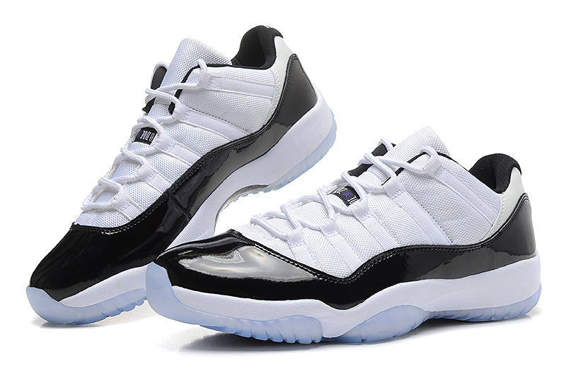 Air Jordan 11 Low Basketball Sneakers in White Black - product image from the listing.