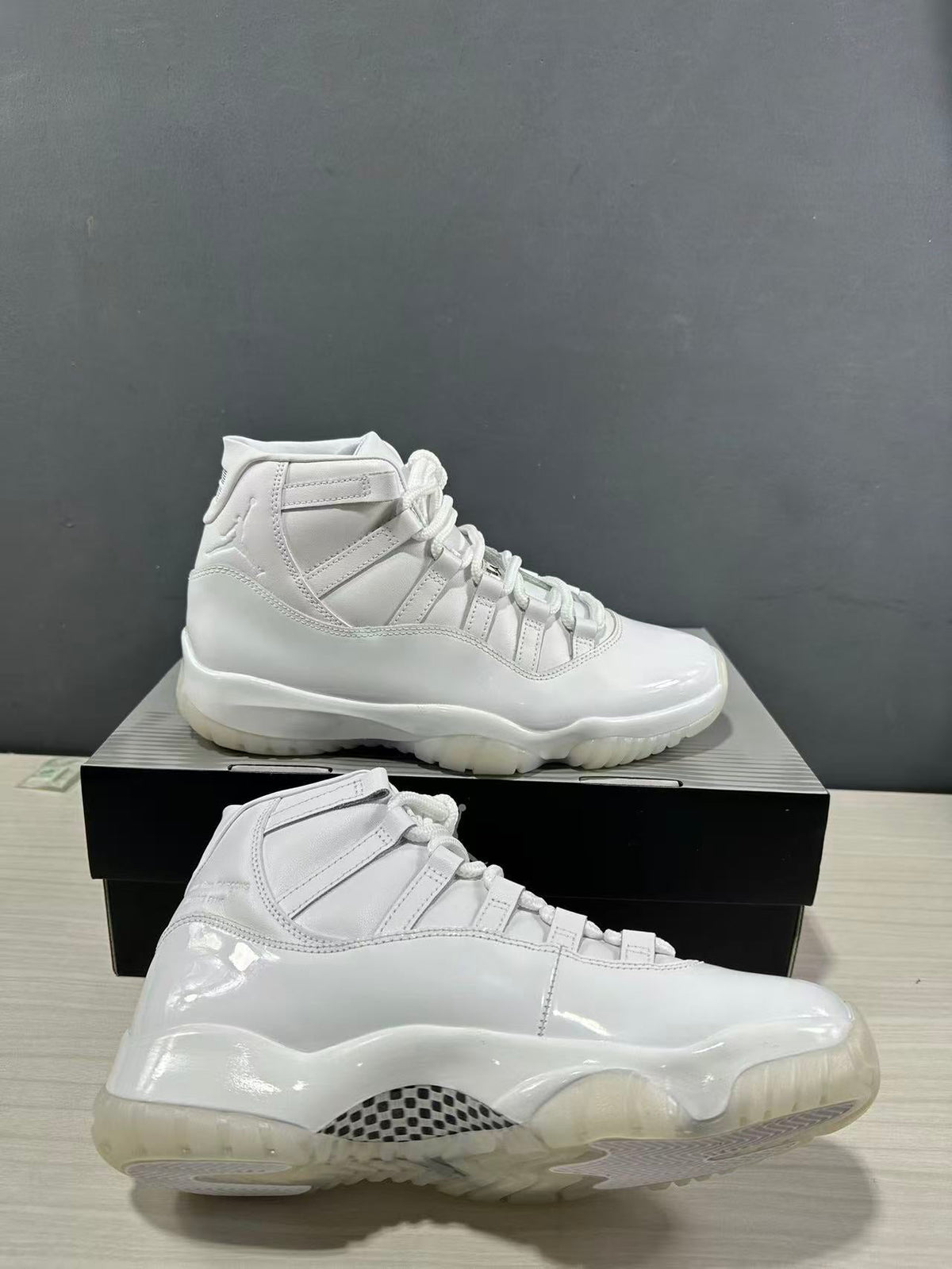 Air Jordan 11 Comme des Garçons White Sneakers IV7639-100 - product image from the listing.