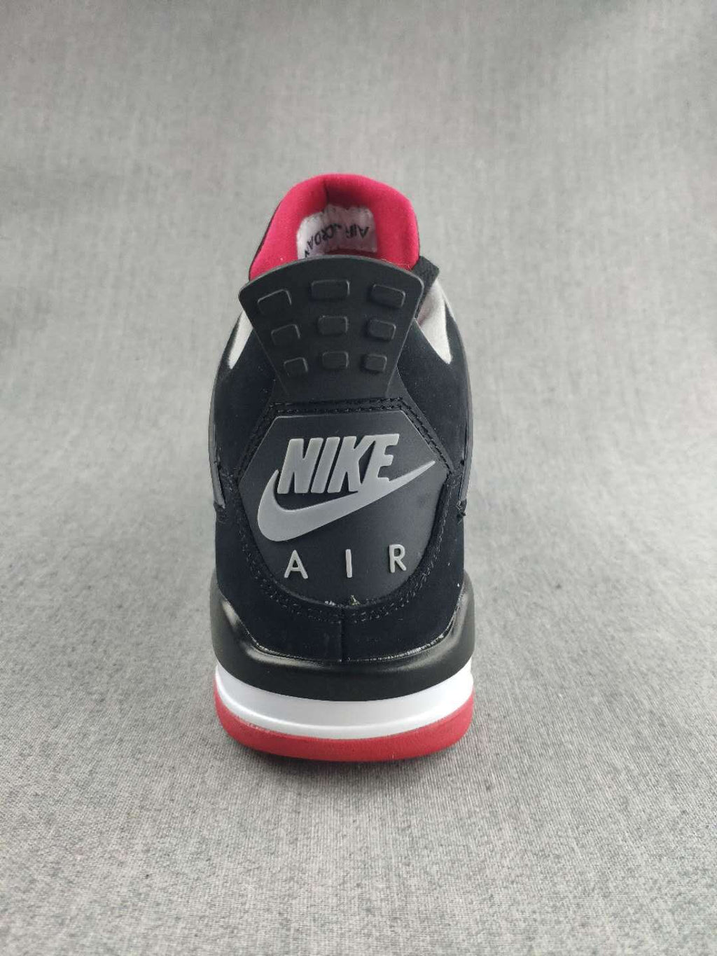 Jordan 4 Retro Sneaker in Black, in Red and White - product image from the listing.