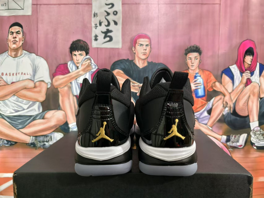 Jordan Black and Gold High-Cut Basketball Sneakers - product image from the listing.