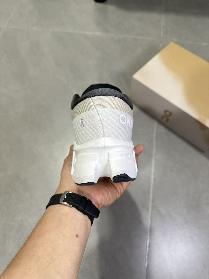 Gray and White On Running Cloudmonster Sneakers - product image from the listing.