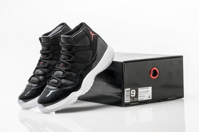 Air Jordan 11 Retro 72-10 High-Top Sneakers in Black and White - product image from the listing.
