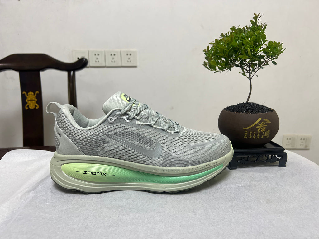 Nike Vomero 18 Running Shoes, in Gray and Volt - product image from the listing.