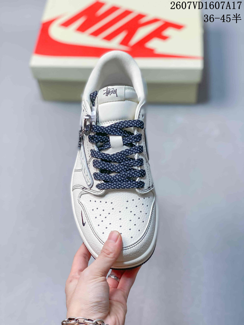 Jordan 1 Low Travis Scott x Stussy Sneakers in White Gray - product image from the listing.