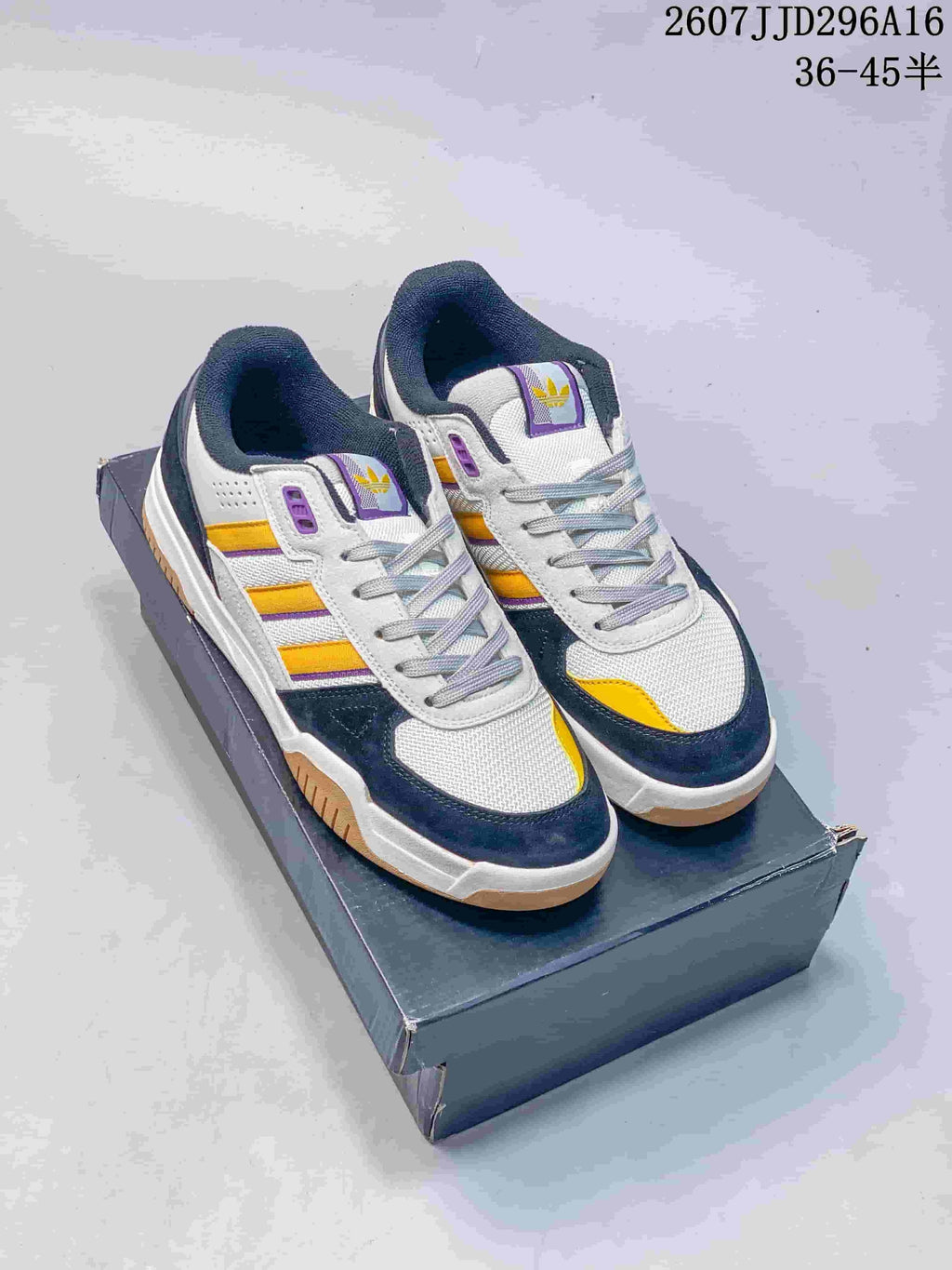 adidas Tekkira Cup Sneakers in White Navy Yellow JJD296A16 - product image from the listing.
