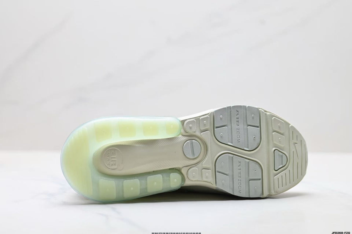 Light Green and White Nike Air Zoom Sneakers - product image from the listing.