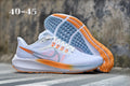 Nike Air Zoom Running Shoes in White Orange Yellow - product image from the listing.