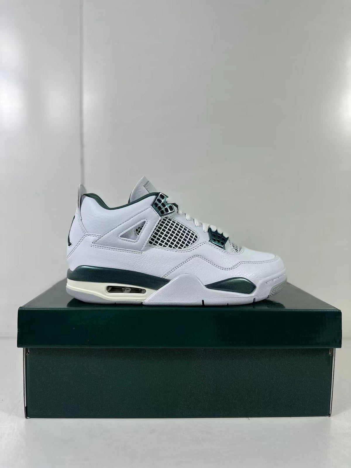 Air Jordan 4 Retro Bucks White Green Sneakers FQ8138-103 - product image from the listing.