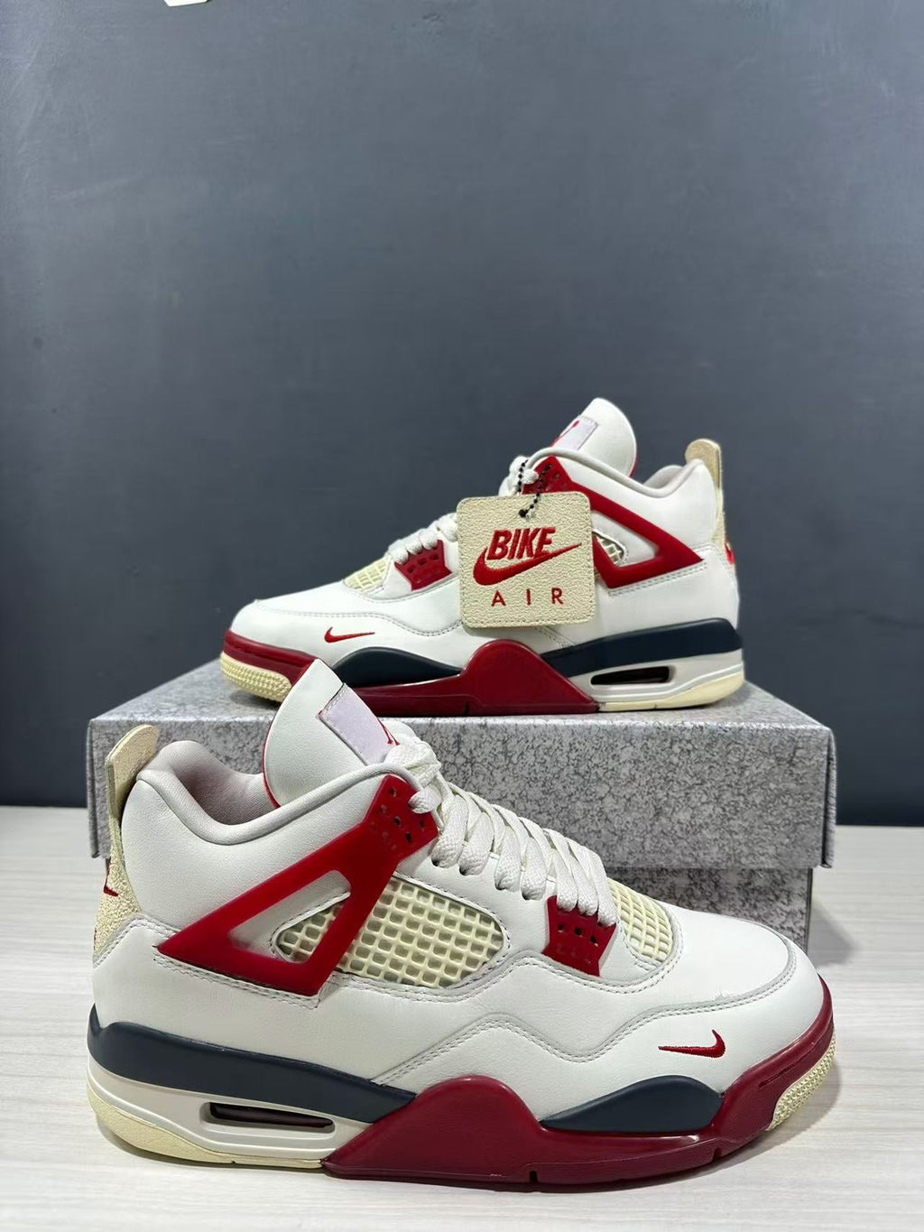 Air Jordan 4 Retro White Red Sneakers - product image from the listing.