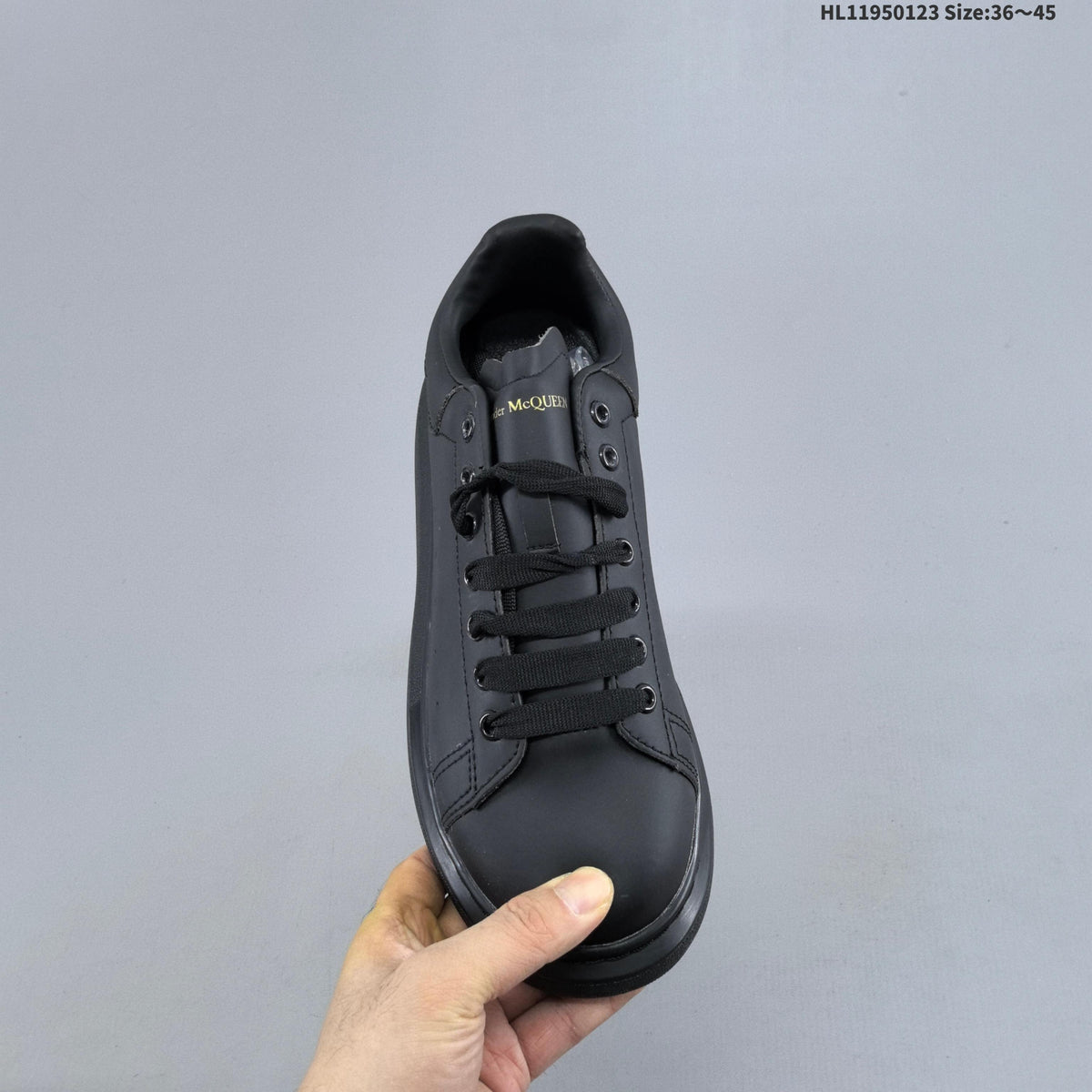 Alexander McQueen Oversized Low-Top Sneakers in Black HL11950123 - product image from the listing.