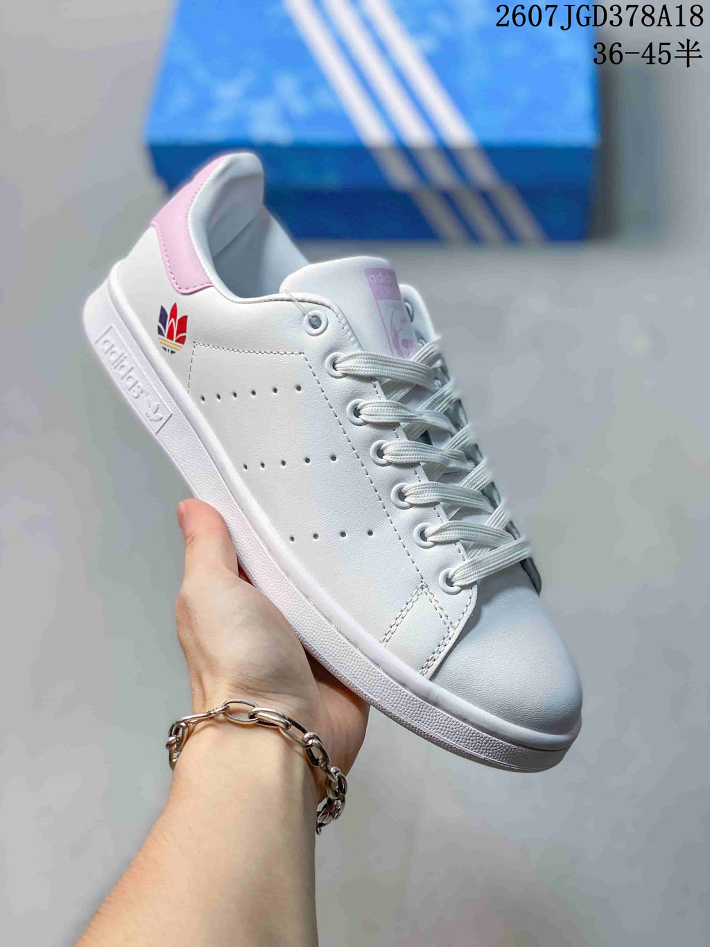 adidas Stan Smith Low-Top Sneakers in White and Pink - product image from the listing.