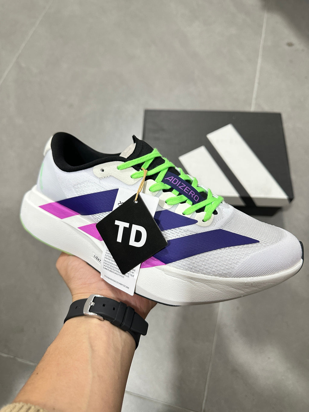 Adizero Lightstrike Pro Running Shoes in White Purple Green - product image from the listing.