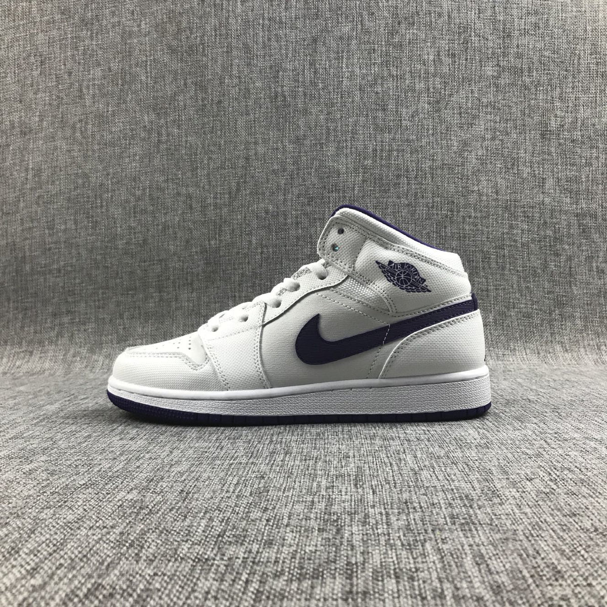 Air Jordan 1 Mid Sneakers in White Purple 332148-137 - product image from the listing.