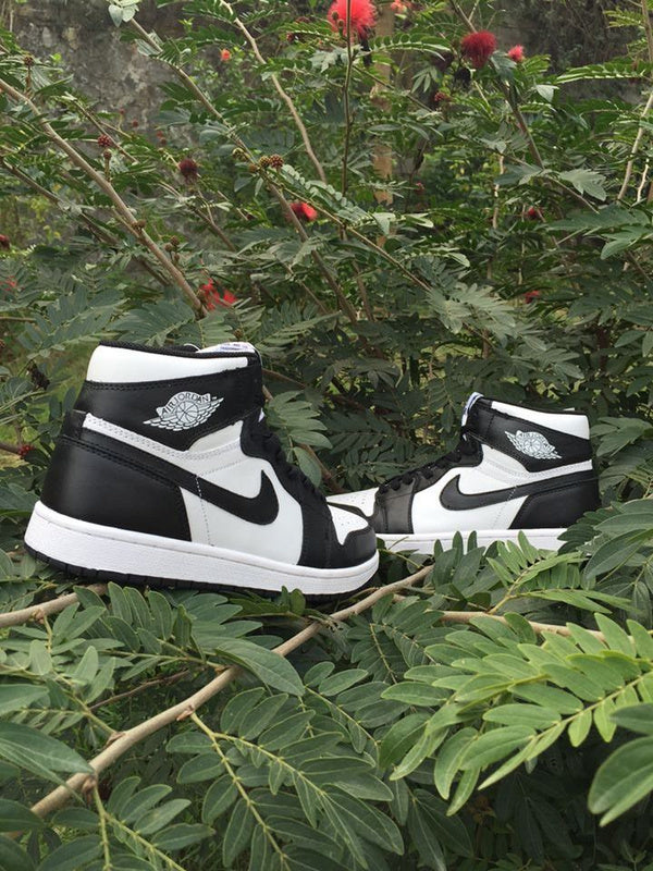 Jordan 1 High Sneakers in Black and White - product image from the listing.