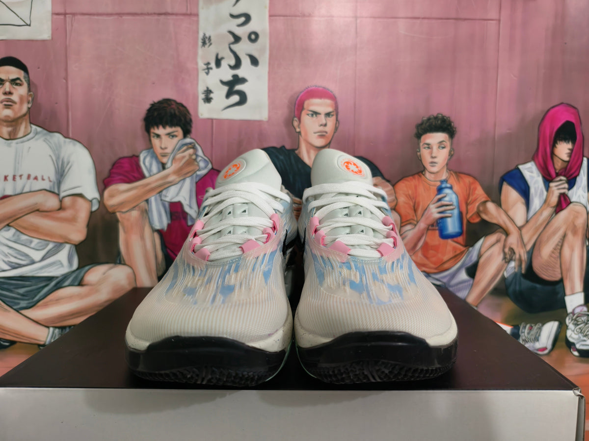 Nike Basketball Footwear in Gray Blue with Pink Accents - product image from the listing.