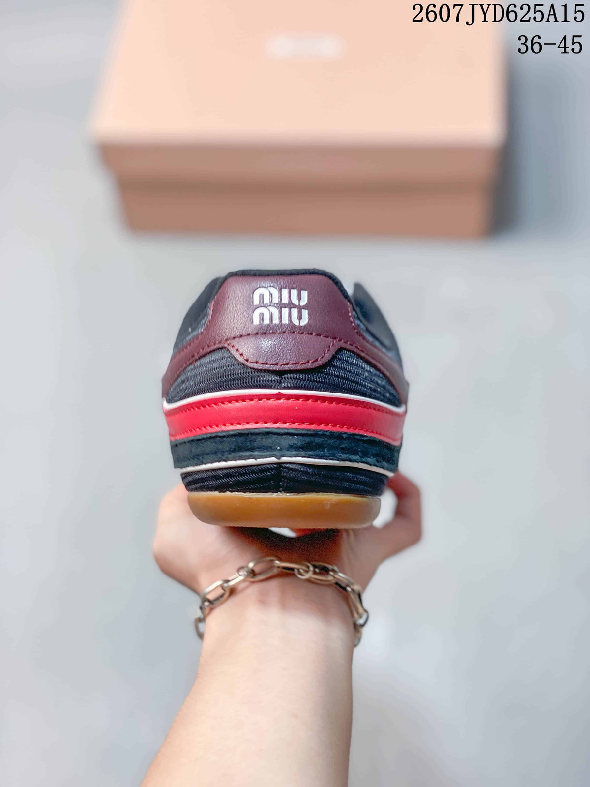 Miu Miu Gymnasium Low-Top Sneakers in Black Red 2607JYD625A15 - product image from the listing.