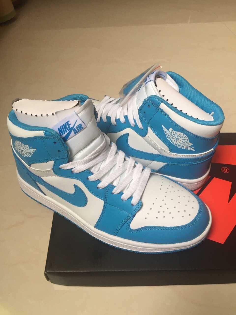 Jordan 1 High Sneakers in White and Blue - product image from the listing.