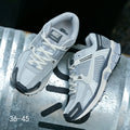 Light Gray and Navy Nike Air Zoom Vomero 5 Sneakers - product image from the listing.