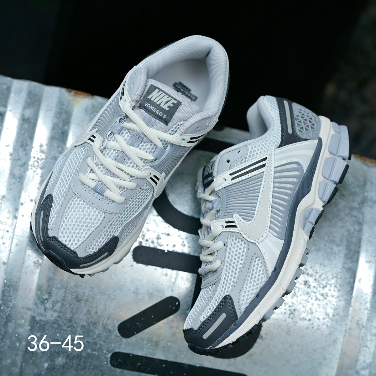 Light Gray and Navy Nike Air Zoom Vomero 5 Sneakers - product image from the listing.
