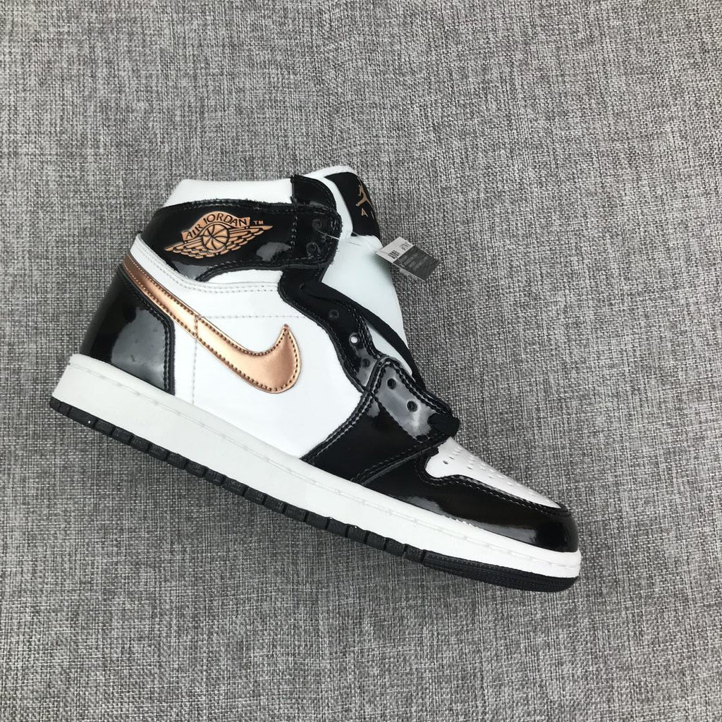 Air Jordan 1 Mid Sneakers in Black White Metallic Gold 852542-007 - product image from the listing.