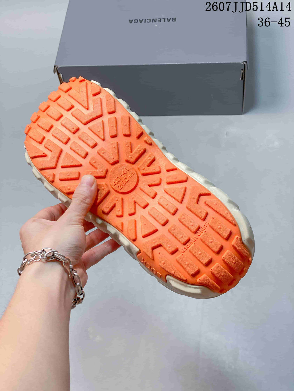 Balenciaga Tire Clog Sandals Off-White in Orange 2607JJD514A14 - product image from the listing.