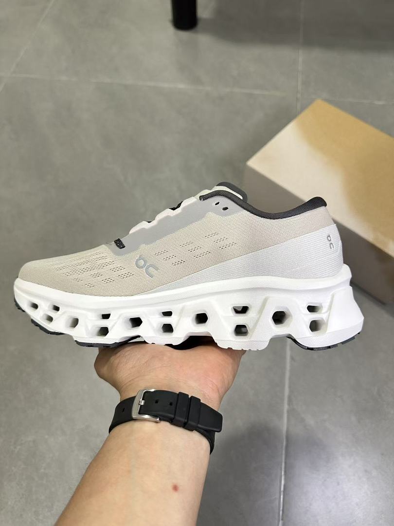 Gray and White On Running Cloudmonster Sneakers - product image from the listing.