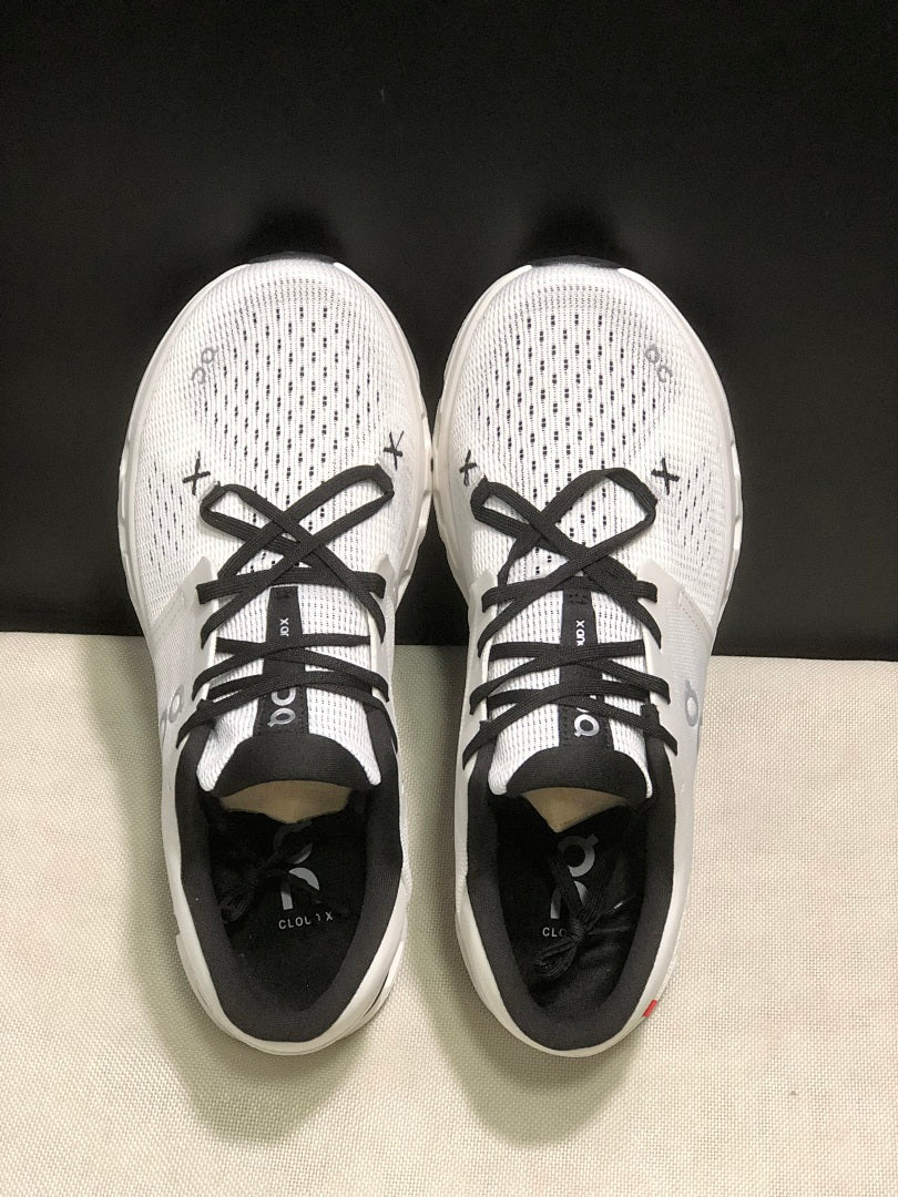On Cloud X 4 Sneakers in Ivory and Black - product image from the listing.
