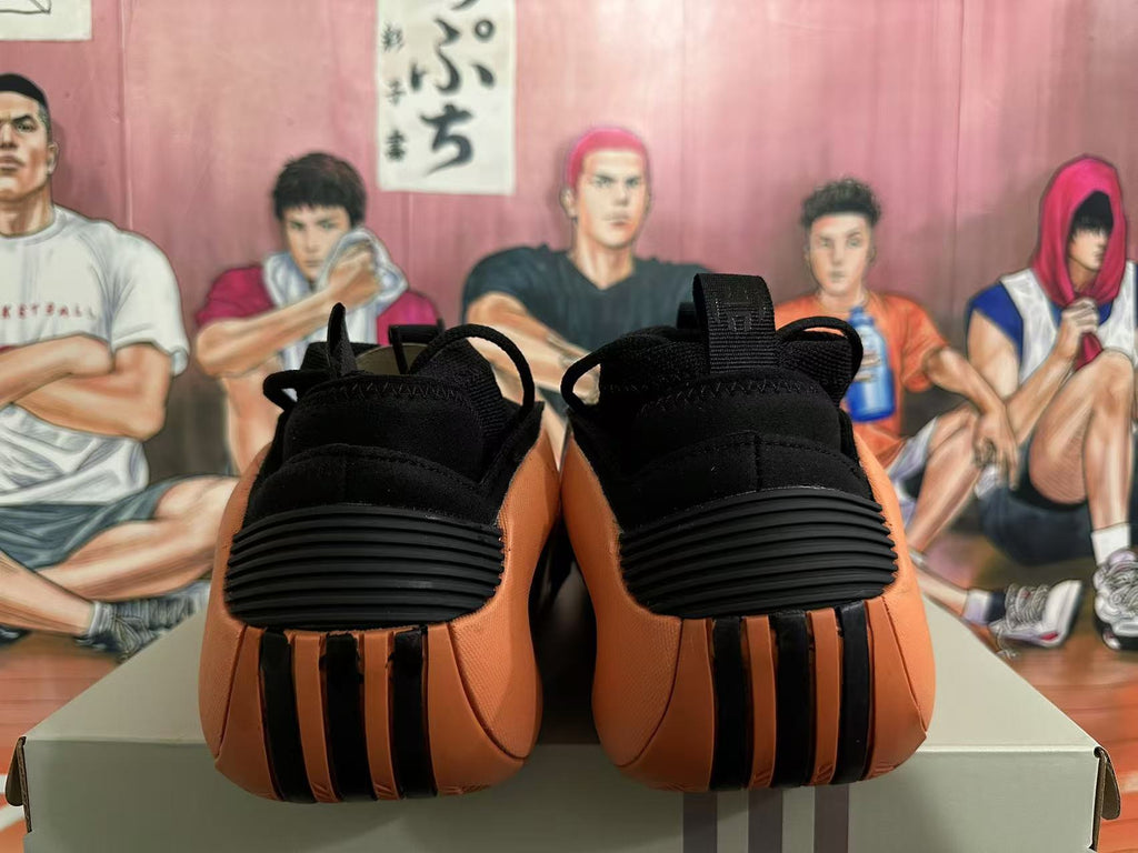 Basketball Sneakers in Black and Orange - product image from the listing.