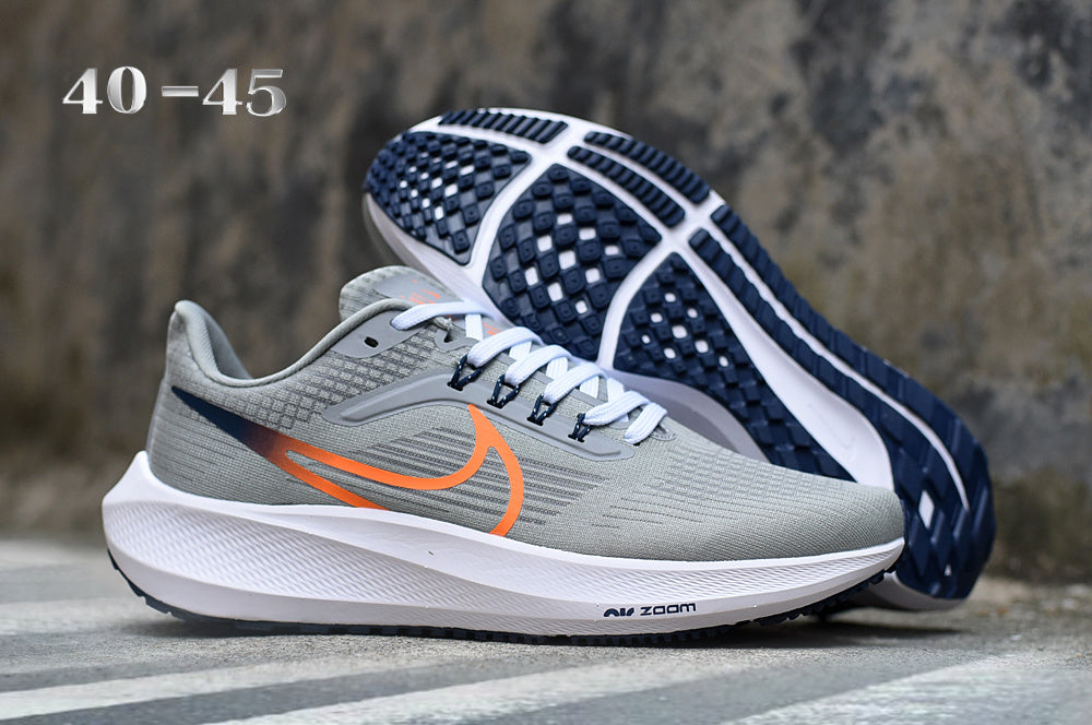 Smoke Gray and Orange Nike Zoom Running Shoes - product image from the listing.